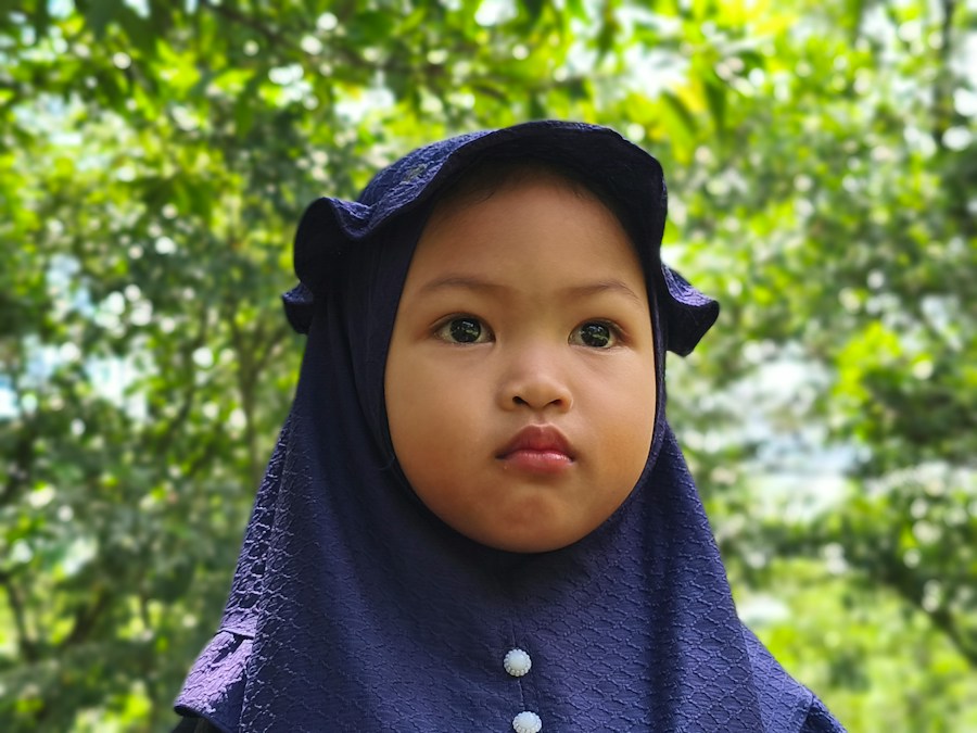 Smiling young student in a blue hijab
